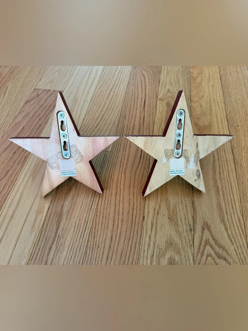 Pottery Barn distressed star shaped wall hooks maroon color 7”